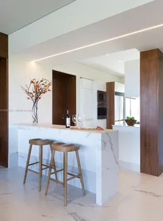 a kitchen with stainless steel appliances a stove a refrigerator and cabinets