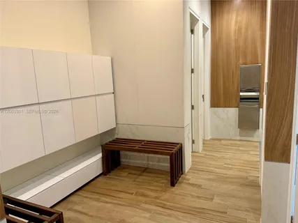 a living room with furniture a table and a large window