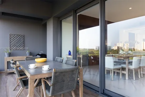a view of a dining room with furniture and window