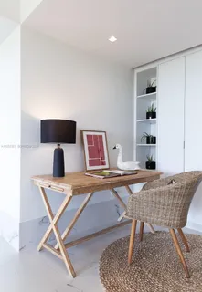a workspace with furniture and window