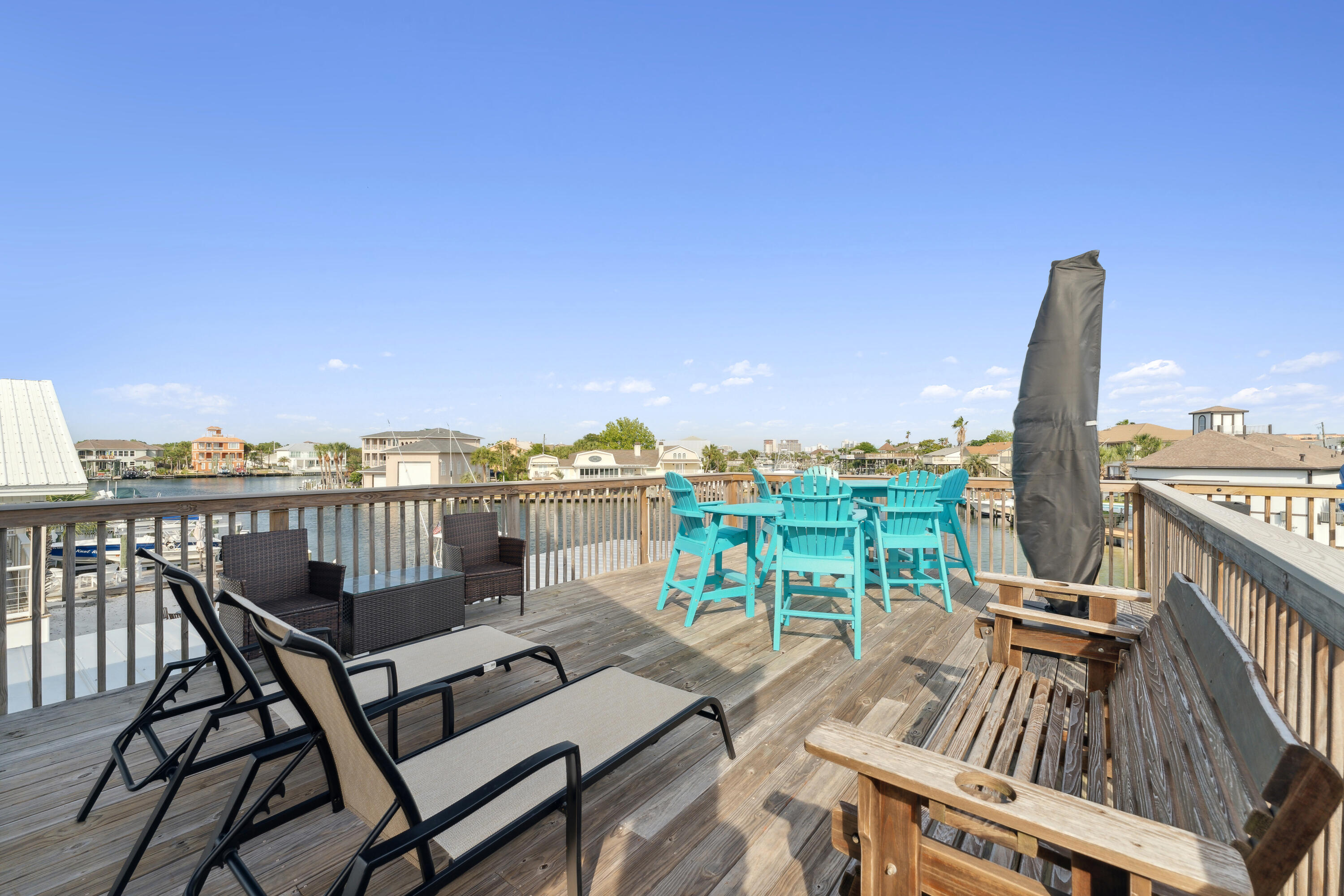 129 Durango Road, Unit 1 Destin, FL 32541 - Photo 50 of 71 a view of a balcony with wooden floor and outdoor seating