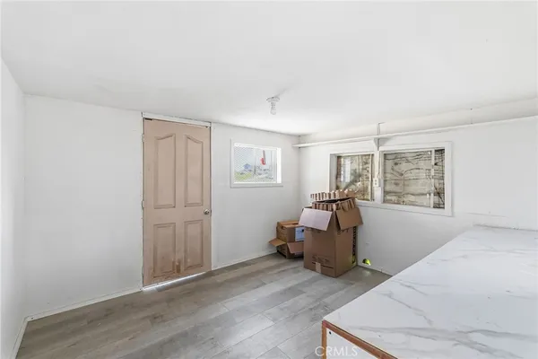 a kitchen with a refrigerator and a sink