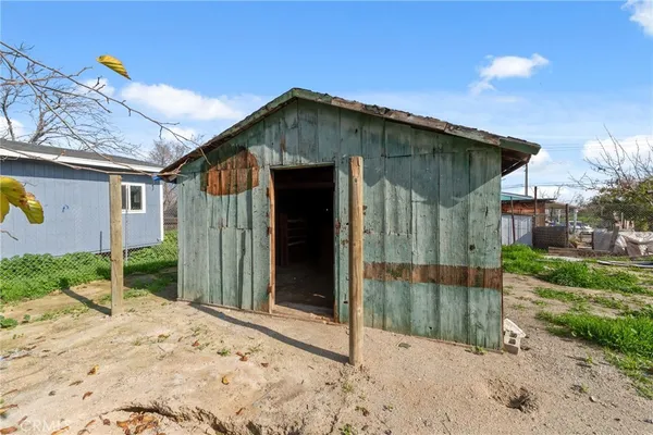 a view of a garage of wooden wall