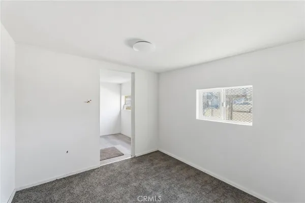 an empty room with a bathroom