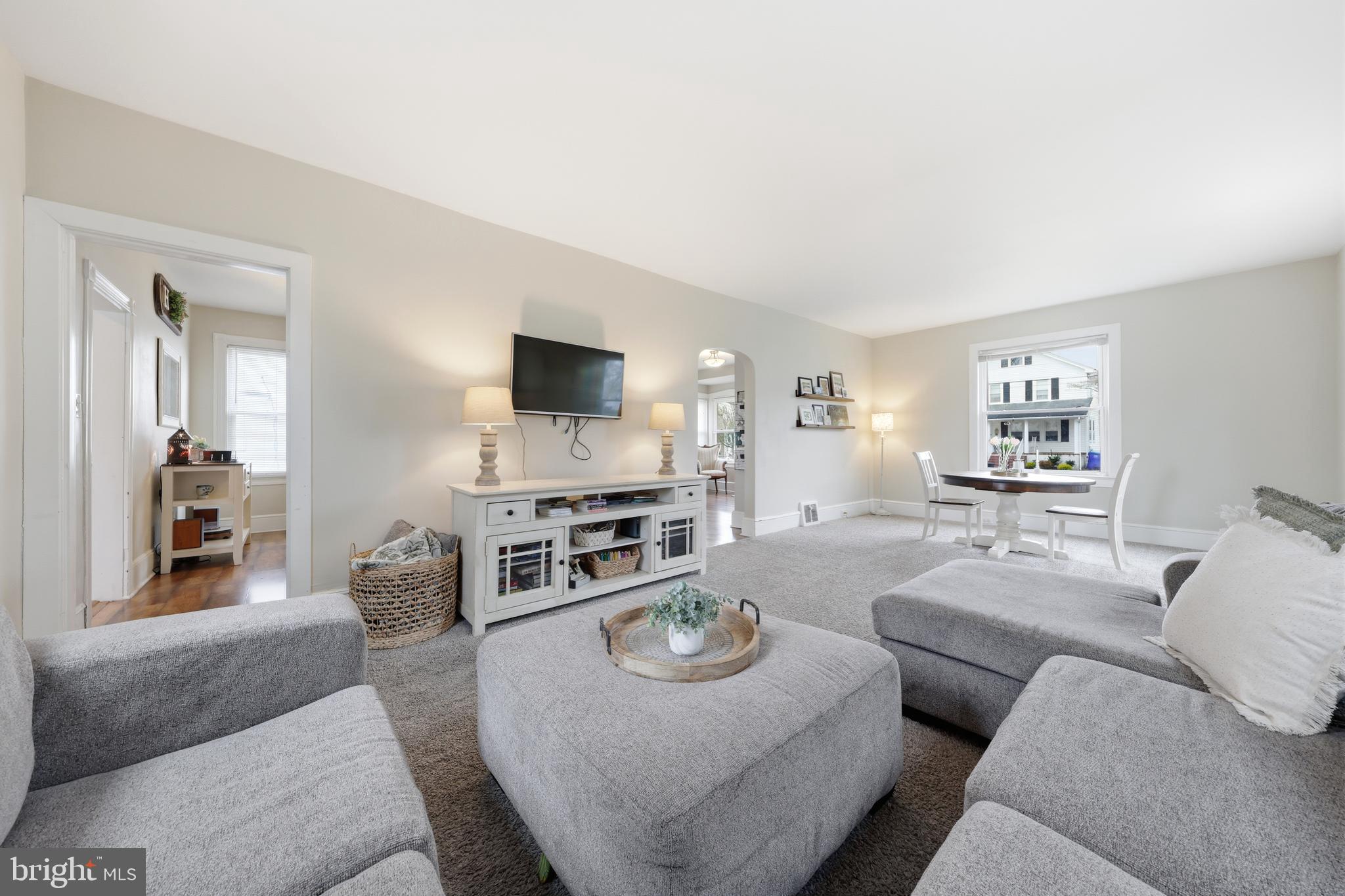 212 Grape Street Hammonton, NJ 08037 - Photo 12 of 36 a living room with furniture a flat screen tv and kitchen view