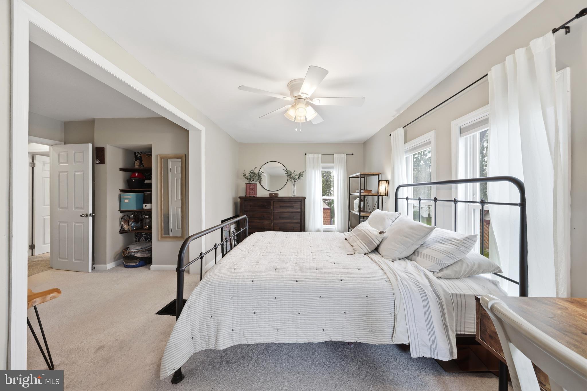 212 Grape Street Hammonton, NJ 08037 - Photo 23 of 36 a bedroom with a bed and a chandelier