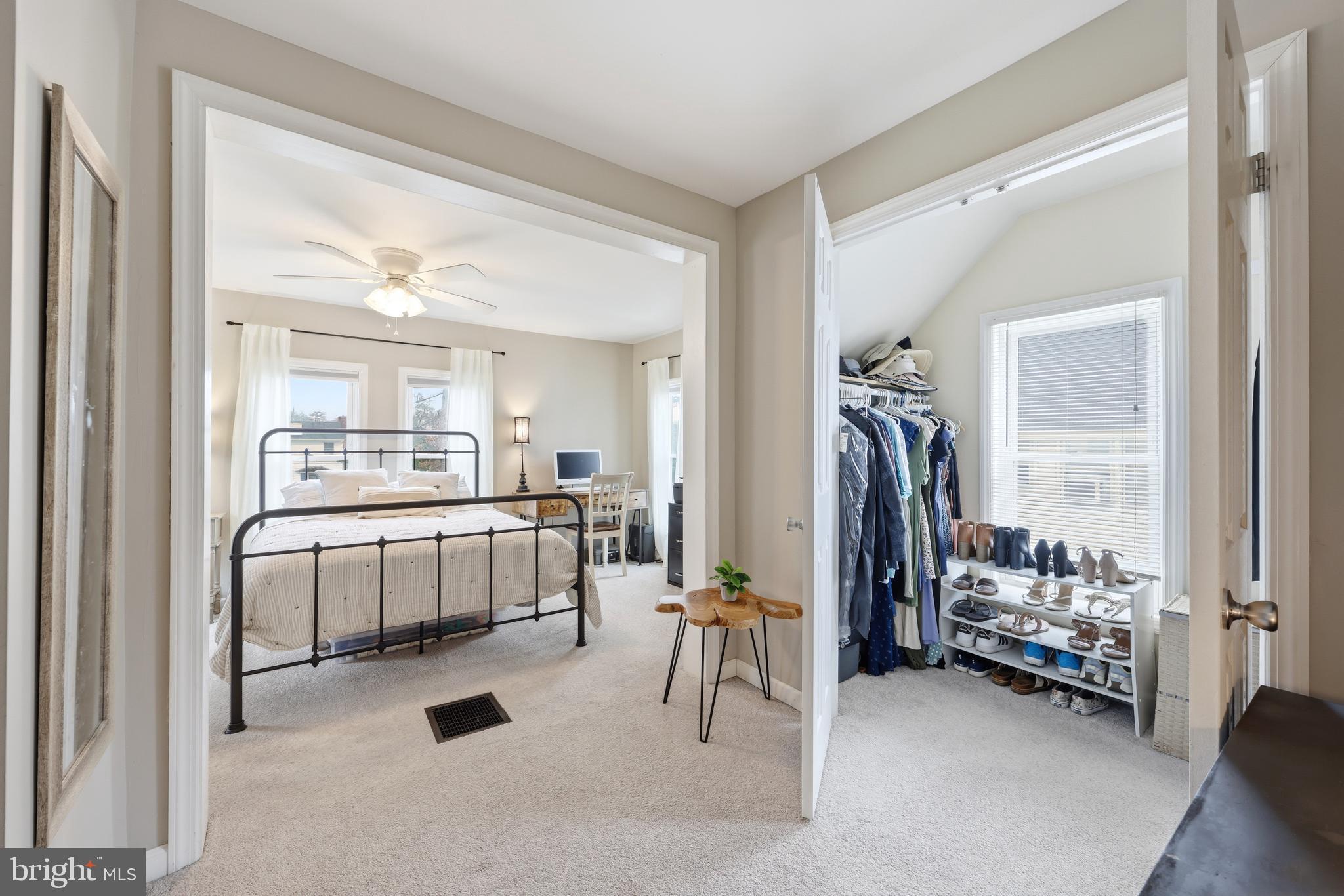 212 Grape Street Hammonton, NJ 08037 - Photo 25 of 36 a spacious bedroom with a bed and a large mirror