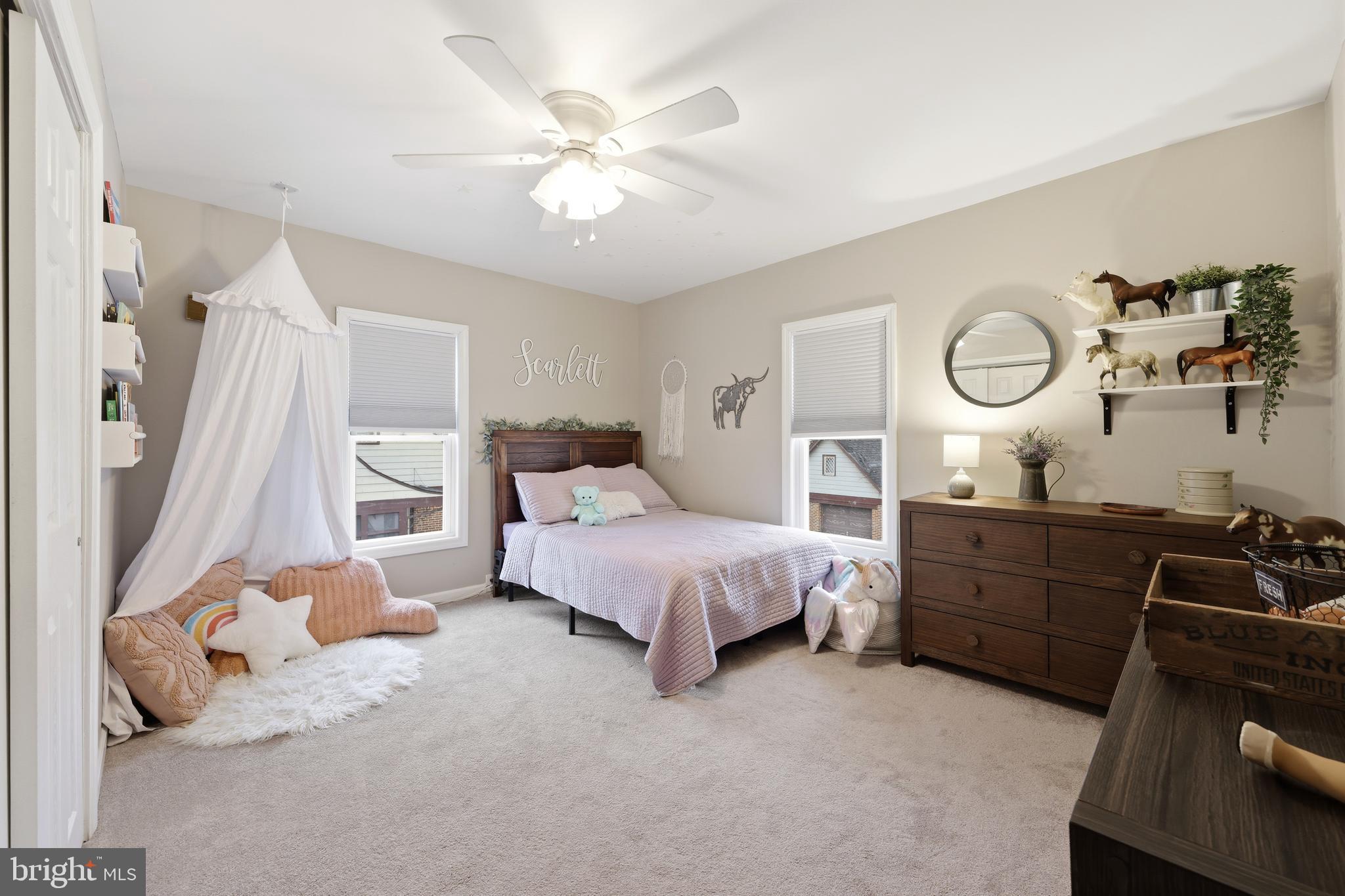 212 Grape Street Hammonton, NJ 08037 - Photo 26 of 36 a spacious bedroom with a bed and a chandelier