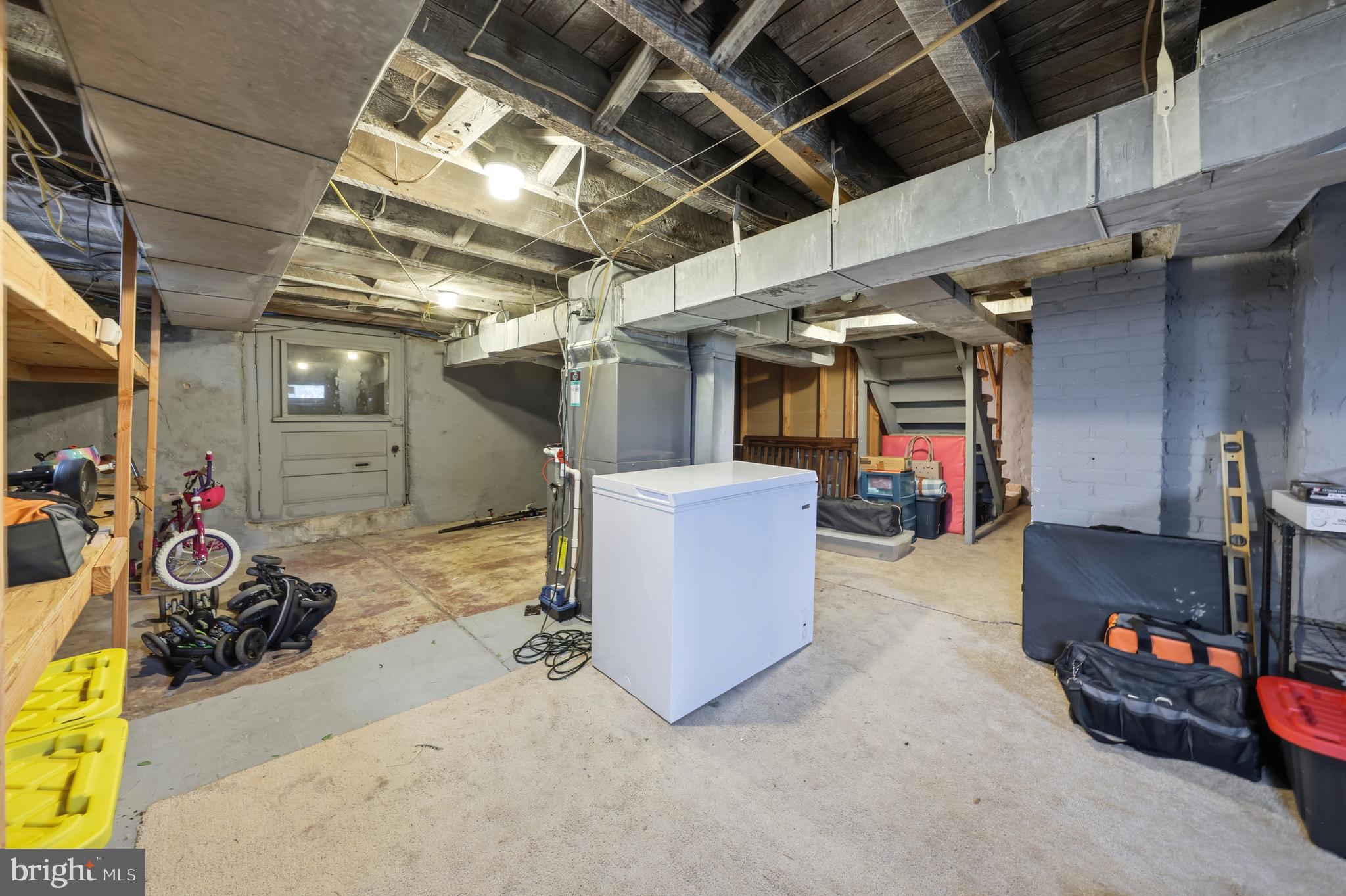 212 Grape Street Hammonton, NJ 08037 - Photo 31 of 36 a view of a garage with a bike and car