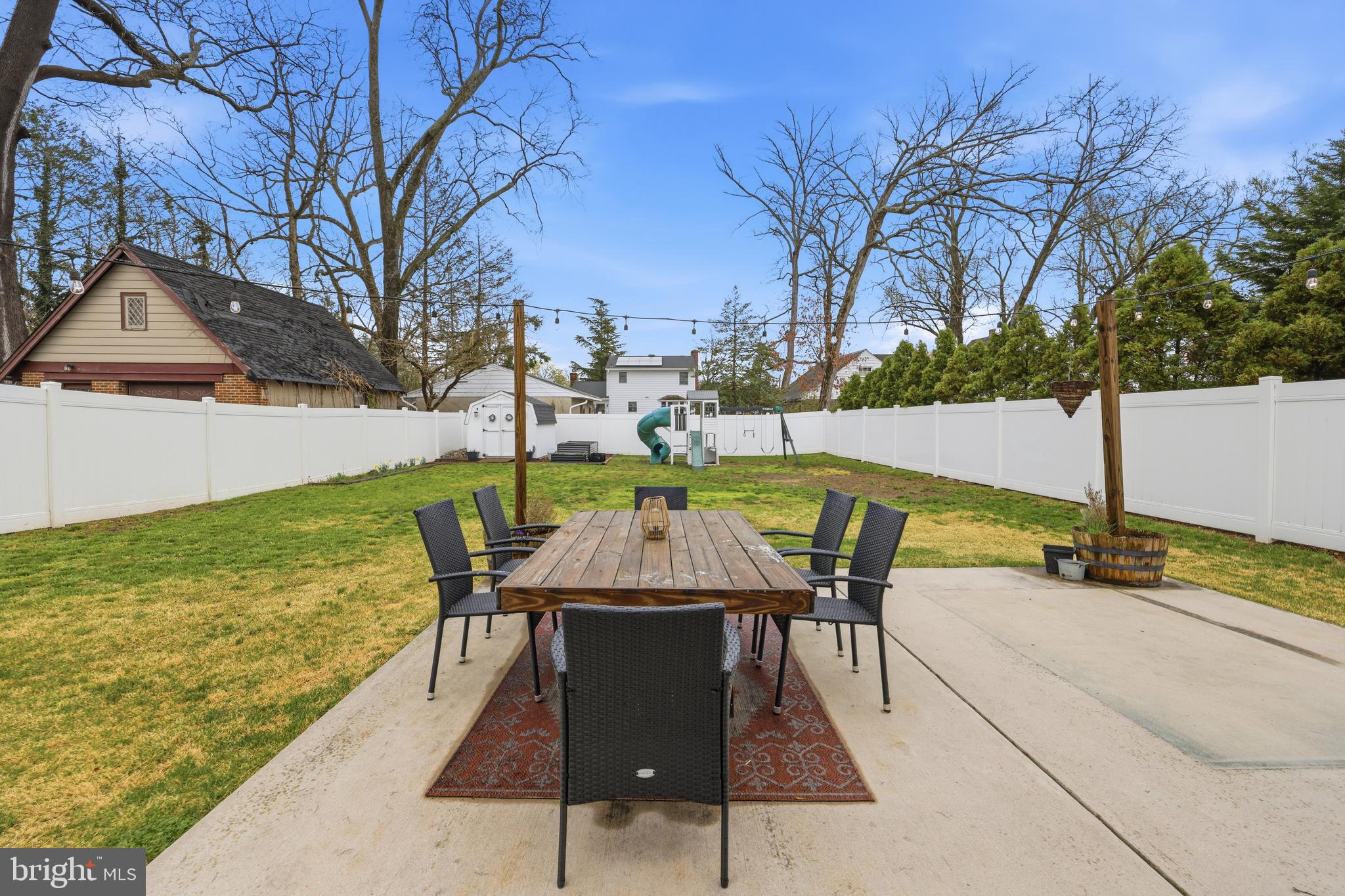 212 Grape Street Hammonton, NJ 08037 - Photo 32 of 36 a view of a patio with table and chairs under an umbrella