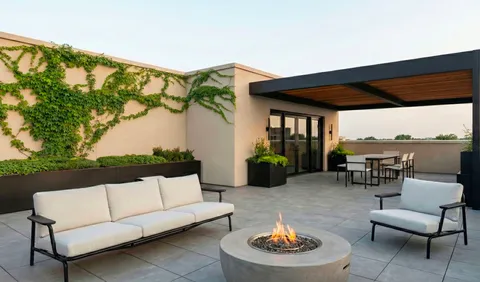 a outdoor living space with furniture and a potted plant