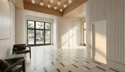 a view of a livingroom with a furniture and large window