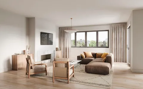 a living room with furniture a fireplace and a large window