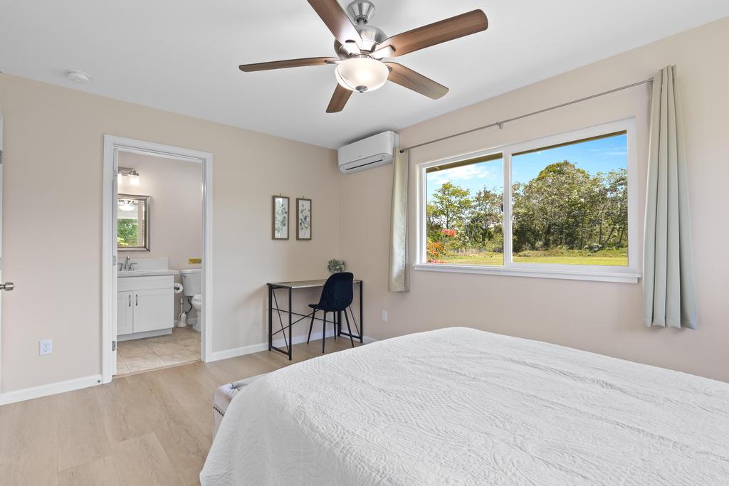 15-1622 12th Avenue Keaau, HI 96749 - Photo 11 of 30 a bedroom with a bed and a table