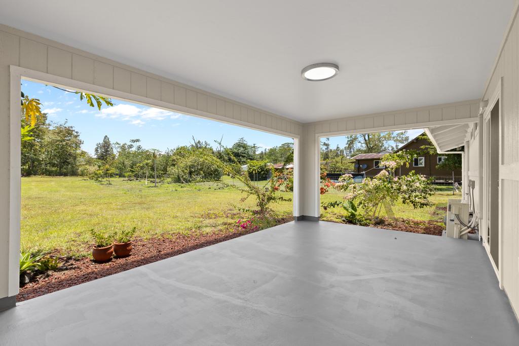 15-1622 12th Avenue Keaau, HI 96749 - Photo 17 of 30 a view of a floor to ceiling window and a ocean view