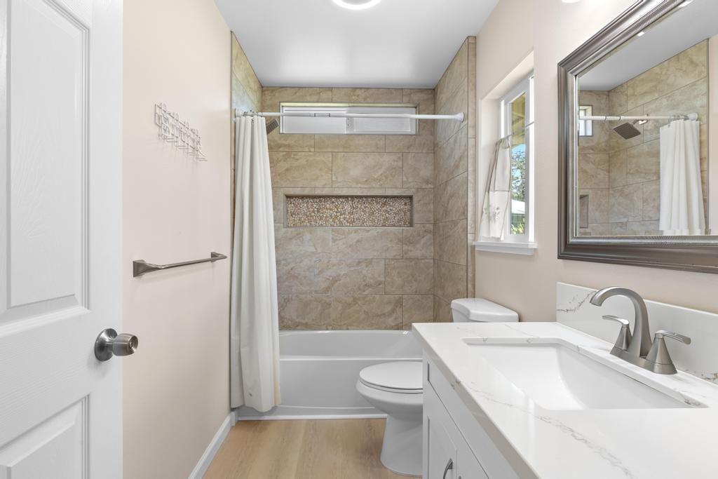 15-1622 12th Avenue Keaau, HI 96749 - Photo 24 of 30 a bathroom with a sink a toilet and shower