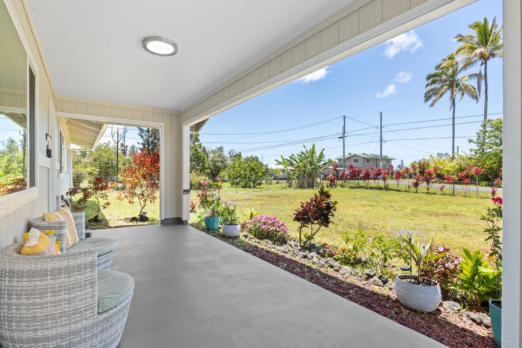 15-1622 12th Avenue Keaau, HI 96749 - Photo 4 of 30 a living room filled with furniture and a garden