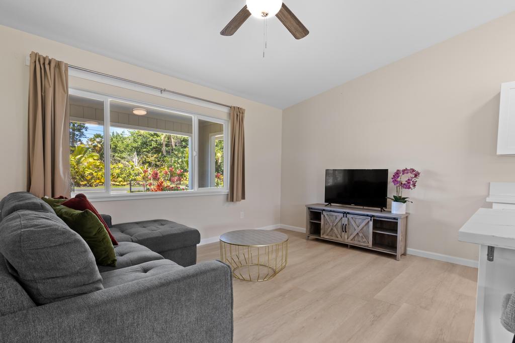 15-1622 12th Avenue Keaau, HI 96749 - Photo 6 of 30 a living room with furniture and a flat screen tv