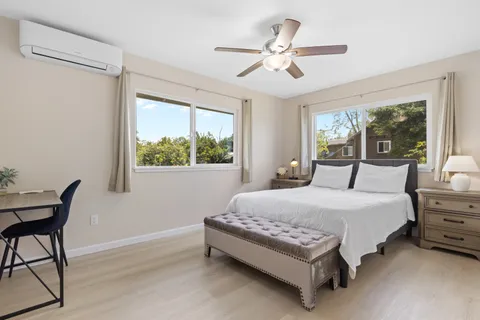 a bedroom with a bed and a table