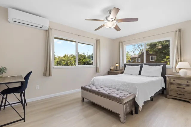 a bedroom with a bed and a table