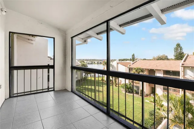 a view of a porch with a floor to ceiling window