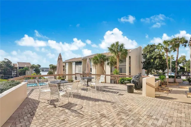 a view of a patio with swimming pool of the house