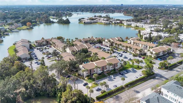 an aerial view of a city with lake view