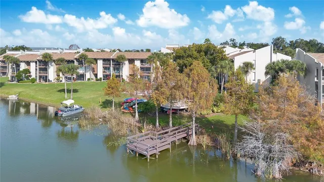 a view of a lake with a house in the background