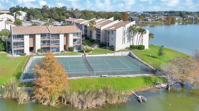a view of a house with pool and a yard