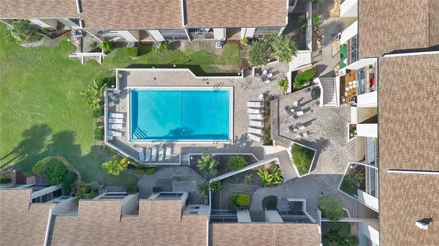 an aerial view of a house with a swimming pool