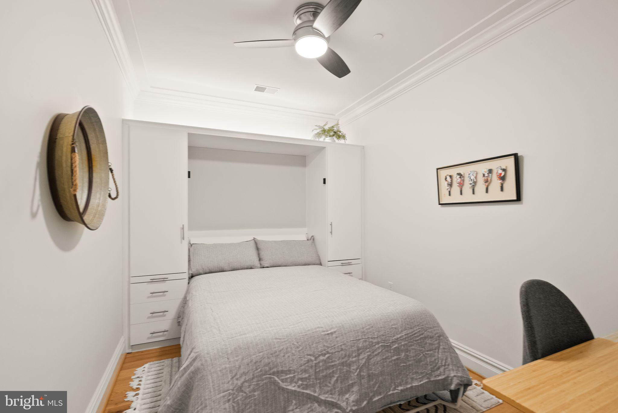 6900 Fleetwood Road, Unit 415 McLean, VA 22101 - Photo 25 of 51 a bedroom with a bed and a chandelier