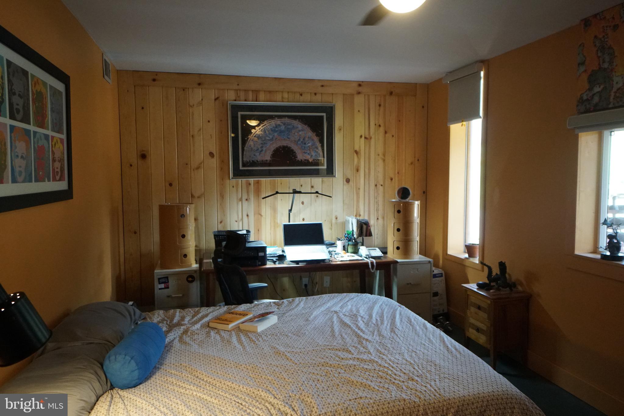 1873 Capito Hill Road Franklin, WV 26807 - Photo 39 of 72 a bedroom with a bed and wooden floor