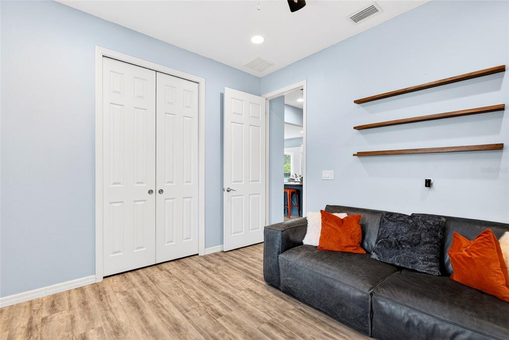 3699 Southwest 177th Lane Road Ocala, FL 34473 - Photo 19 of 26 a living room with furniture and a wooden floor