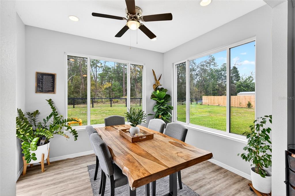 3699 Southwest 177th Lane Road Ocala, FL 34473 - Photo 20 of 26 a living room with furniture and a potted plant