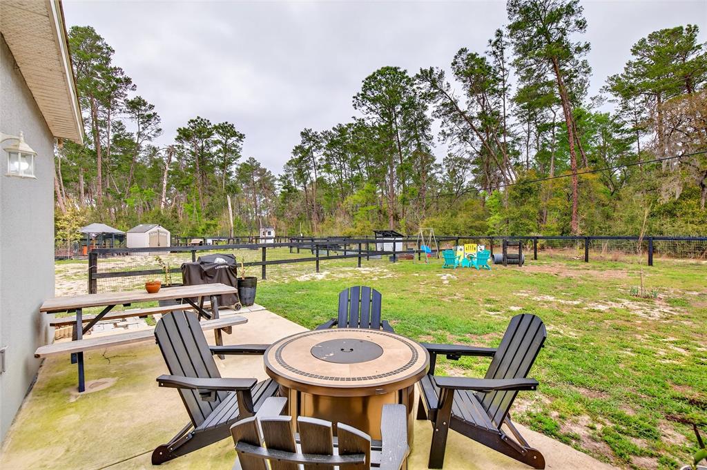 3699 Southwest 177th Lane Road Ocala, FL 34473 - Photo 21 of 26 a view of a swimming pool and lounge chairs