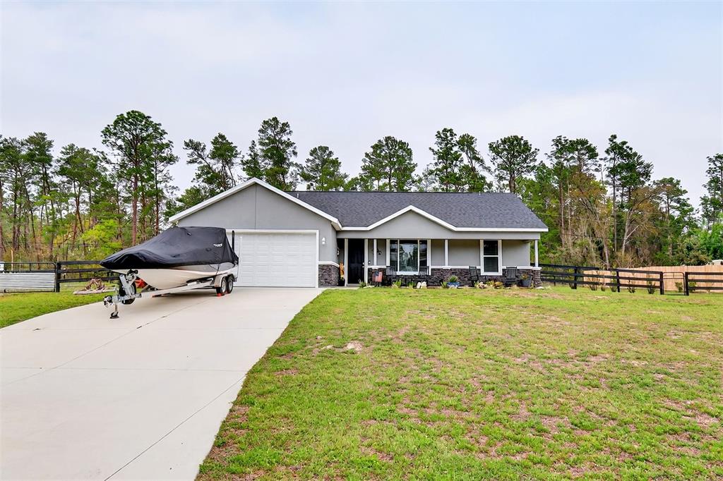 3699 Southwest 177th Lane Road Ocala, FL 34473 - Photo 24 of 26 a house view with a garden space