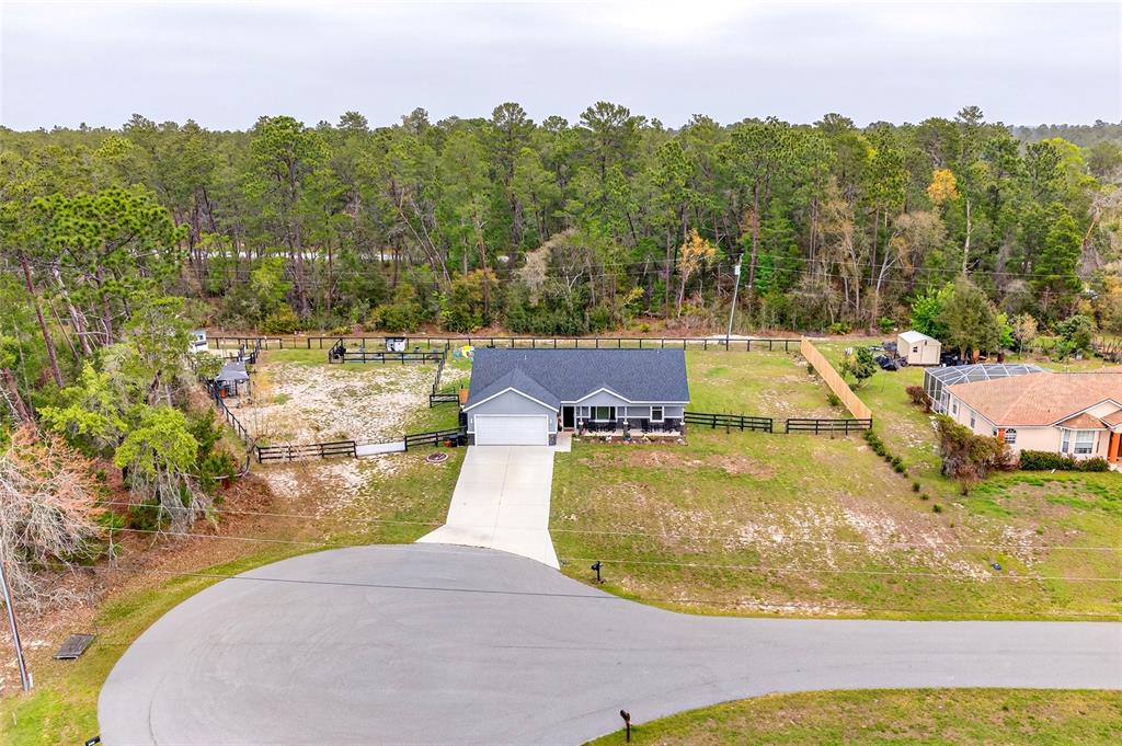 3699 Southwest 177th Lane Road Ocala, FL 34473 - Photo 25 of 26 an aerial view of residential houses with outdoor space and swimming pool