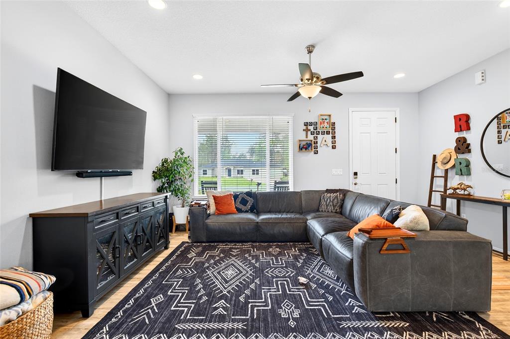 3699 Southwest 177th Lane Road Ocala, FL 34473 - Photo 7 of 26 a living room with furniture and a flat screen tv