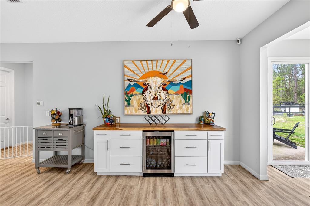 3699 Southwest 177th Lane Road Ocala, FL 34473 - Photo 10 of 26 a view of a workspace with furniture and wooden floor