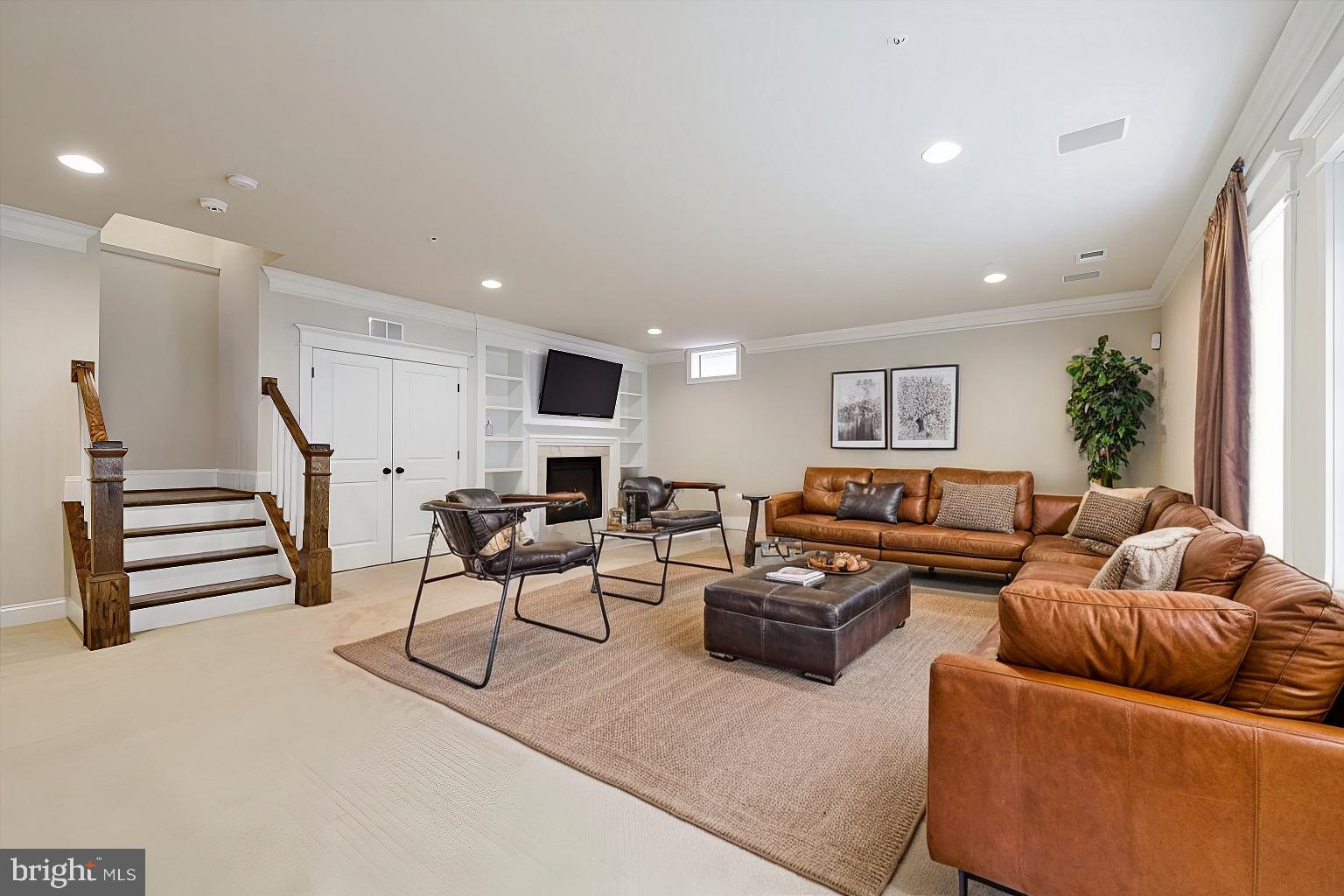 8104 Old Georgetown Road Bethesda, MD 20814 - Photo 23 of 28 a living room with furniture and a flat screen tv