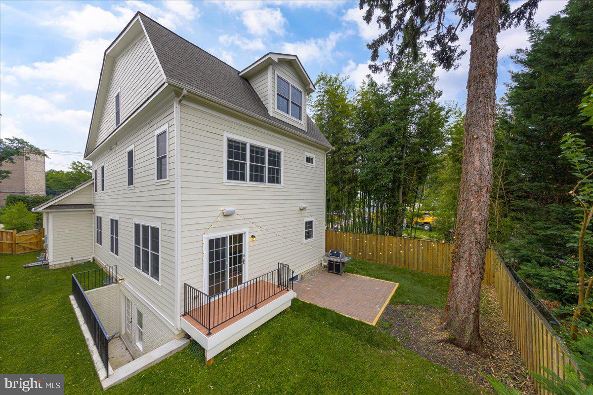8104 Old Georgetown Road Bethesda, MD 20814 - Photo 28 of 28 a view of a house with a yard and sitting area