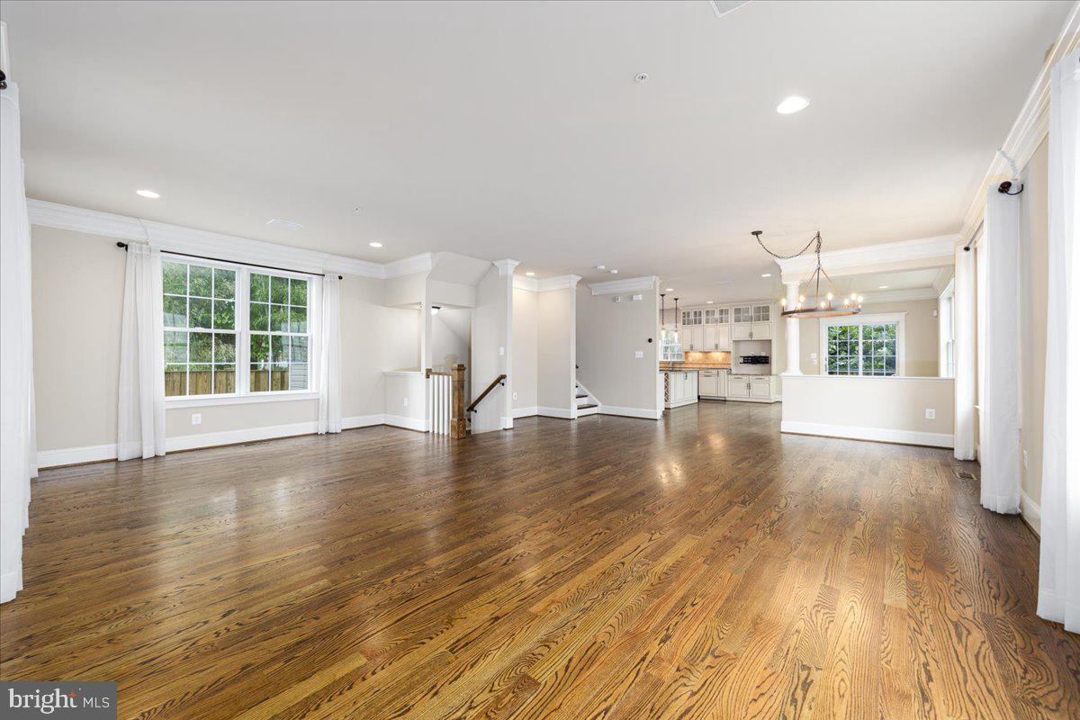 8104 Old Georgetown Road Bethesda, MD 20814 - Photo 5 of 28 a view of empty room with wooden floor and windows