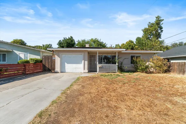 front view of a house with a patio