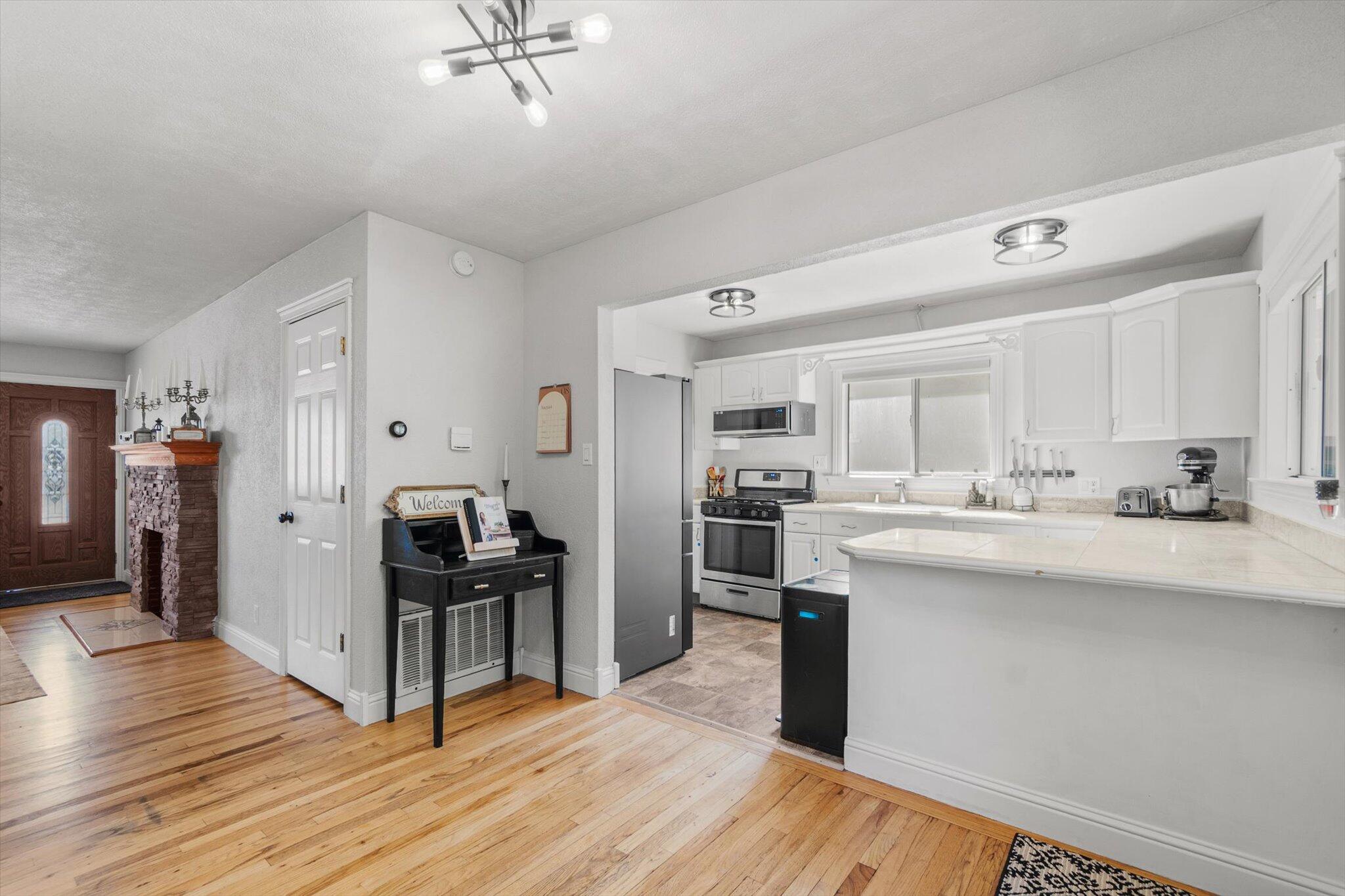 1514 Walbridge Street Red Bluff, CA 96080 - Photo 11 of 36 a kitchen with stainless steel appliances a sink cabinets and wooden floor