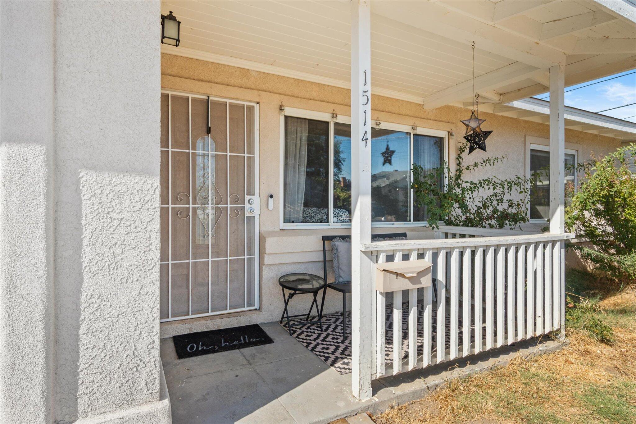 1514 Walbridge Street Red Bluff, CA 96080 - Photo 3 of 36 a view of a porch with a door and a window