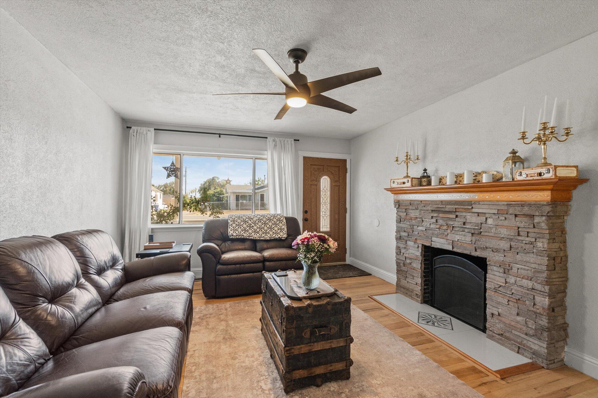 1514 Walbridge Street Red Bluff, CA 96080 - Photo 4 of 36 a living room with furniture and a fireplace