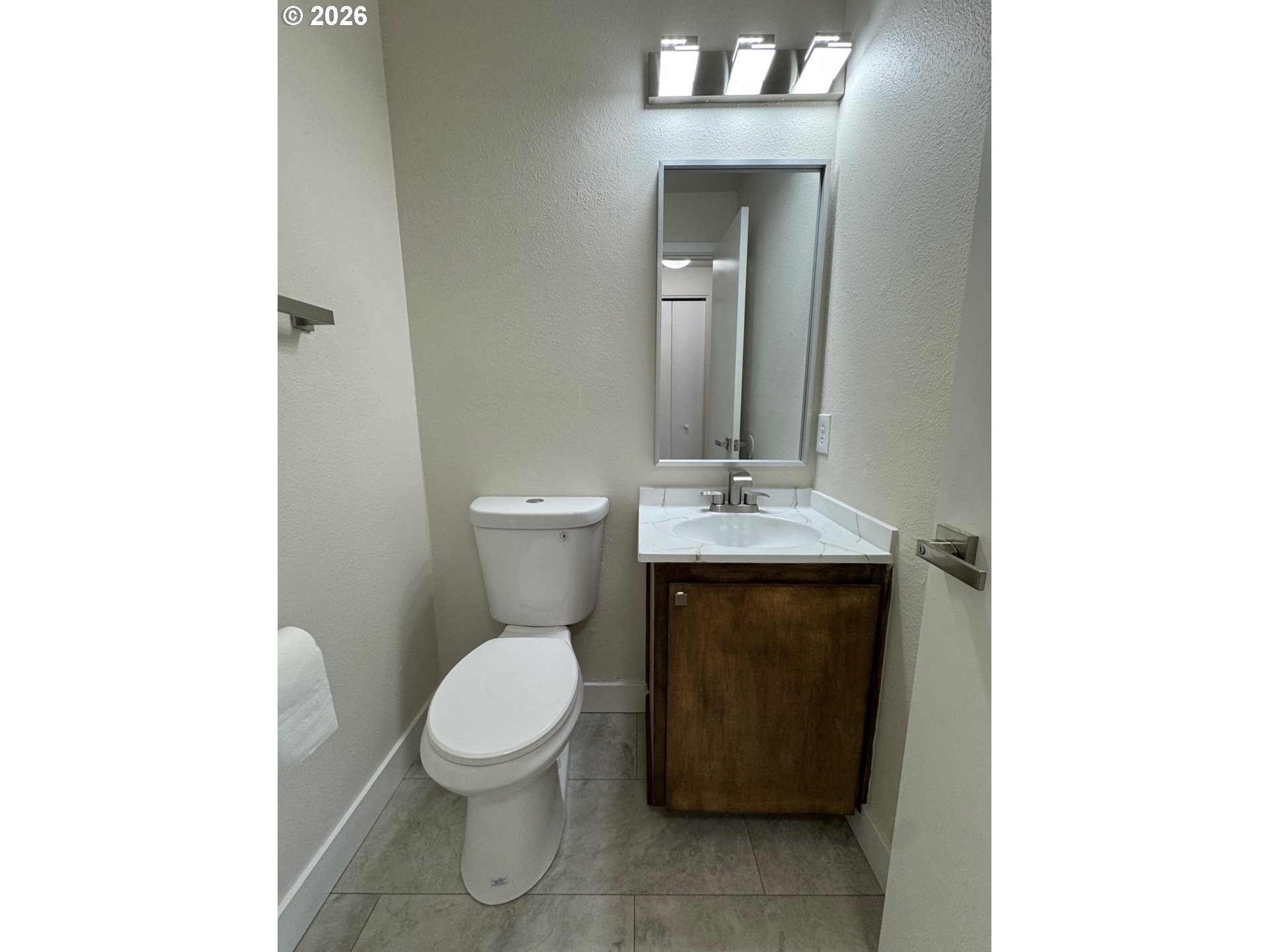 19901 Southwest Meadowbrook Court Beaverton, OR 97078 - Photo 15 of 24 a bathroom with a toilet a sink and mirror