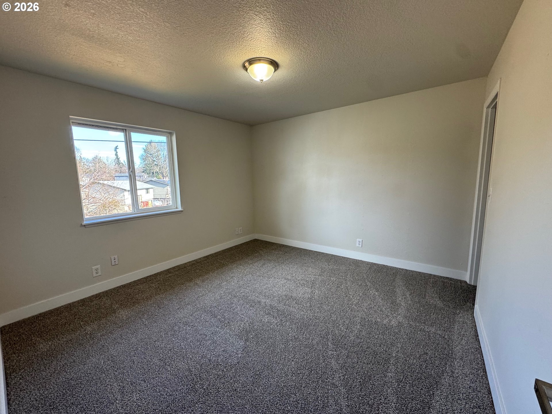 19901 Southwest Meadowbrook Court Beaverton, OR 97078 - Photo 17 of 24 an empty room with windows
