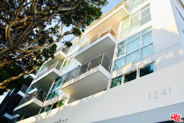 a view of building with a tree