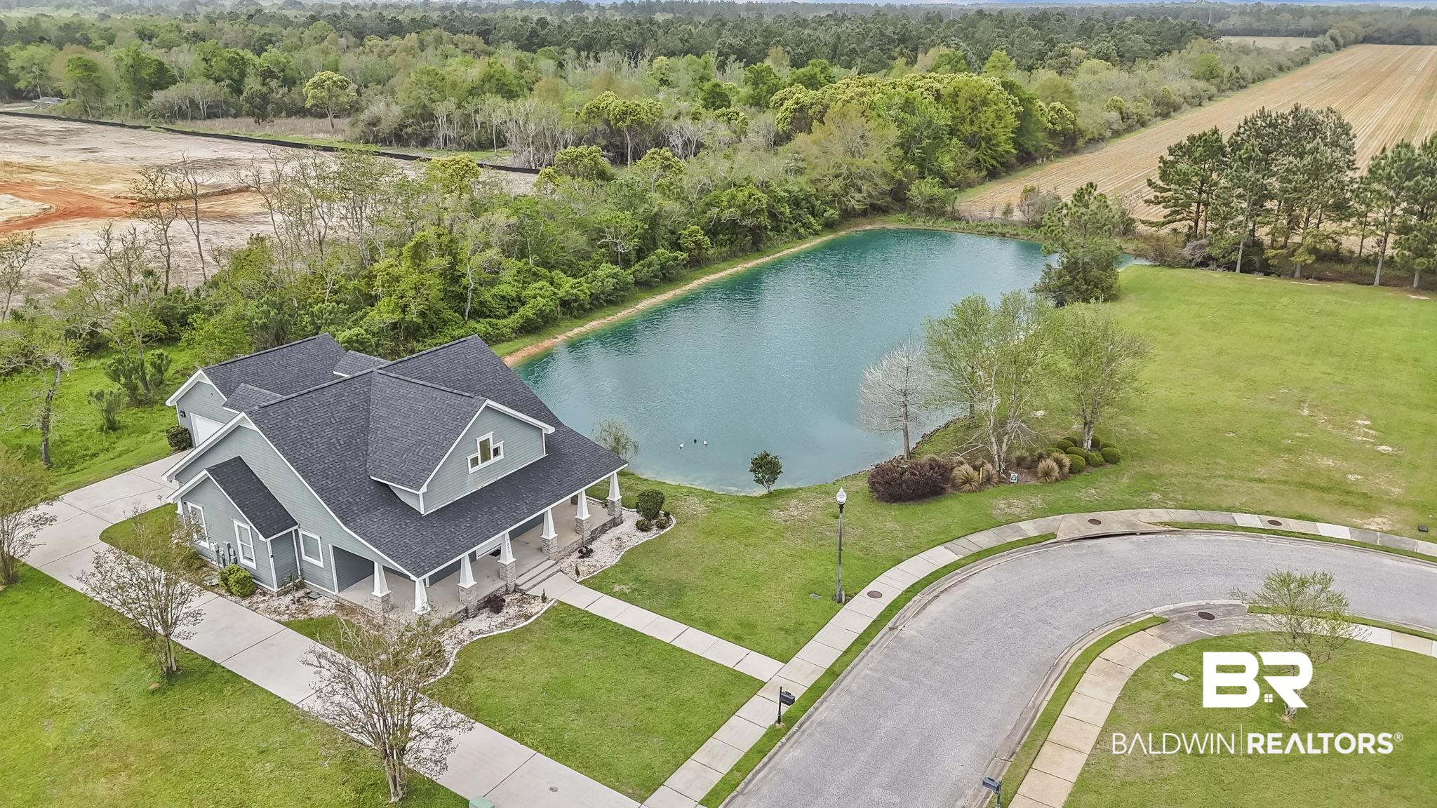 7059 Rocky Rd Loop Gulf Shores, AL 36542 - Photo 11 of 46 Bird's eye view featuring a forest view and a water view